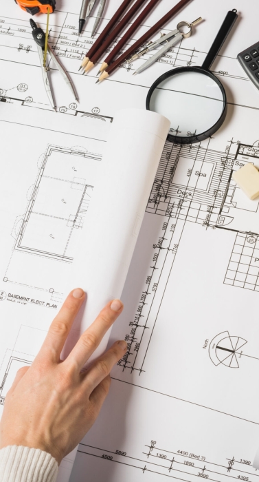 crop-architect-opening-blueprint